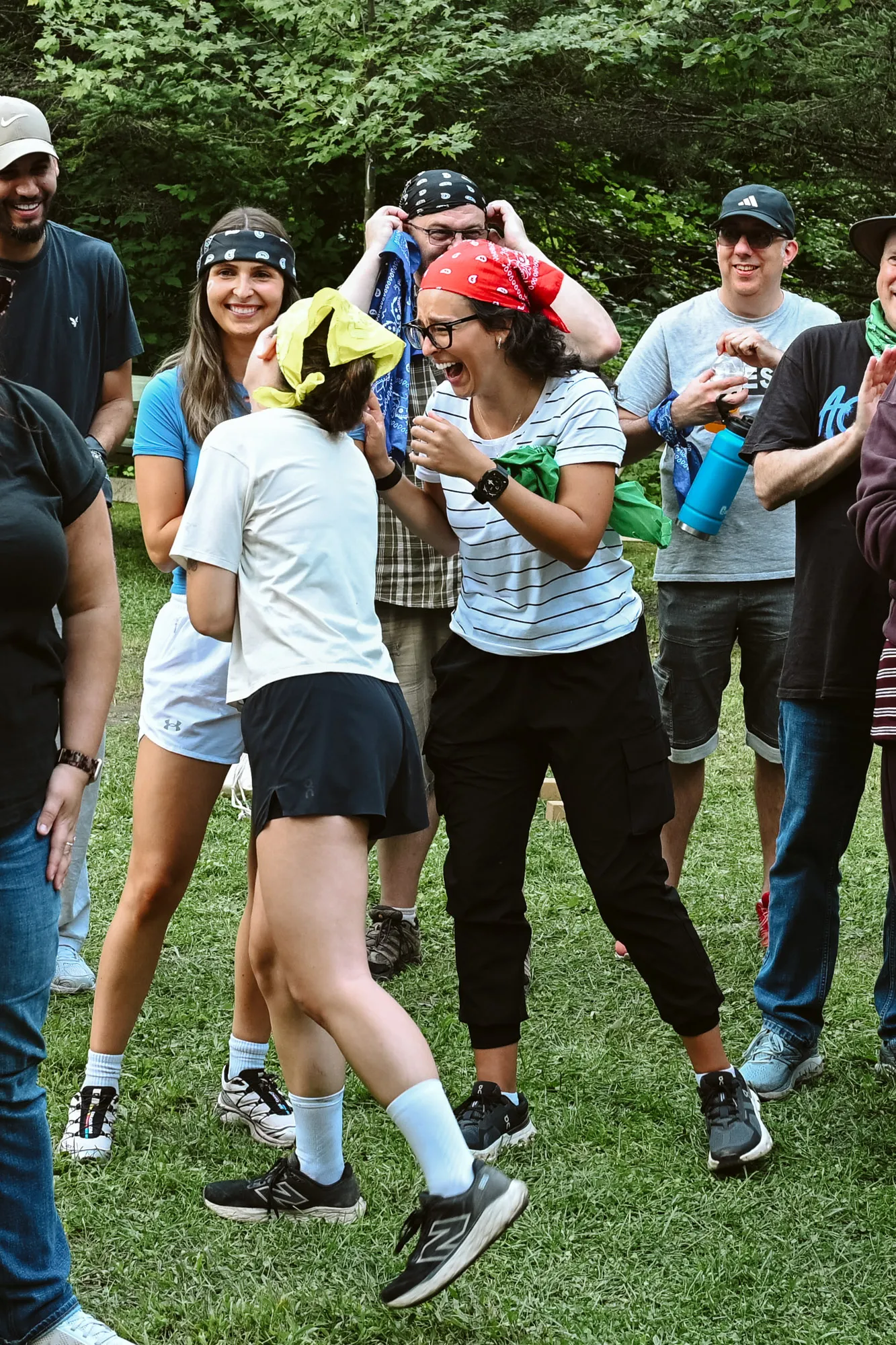 Purkinje team members laughing together during an outdoor team activity